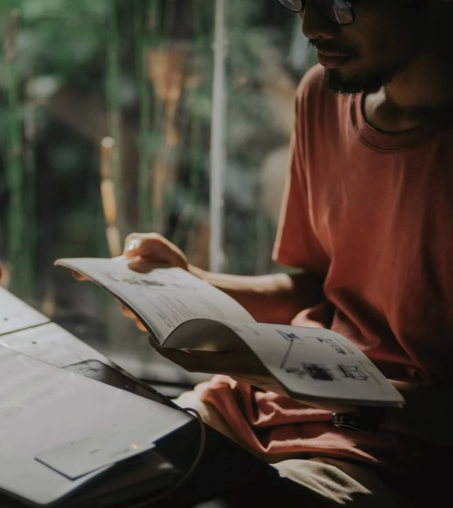 Man studying pictures