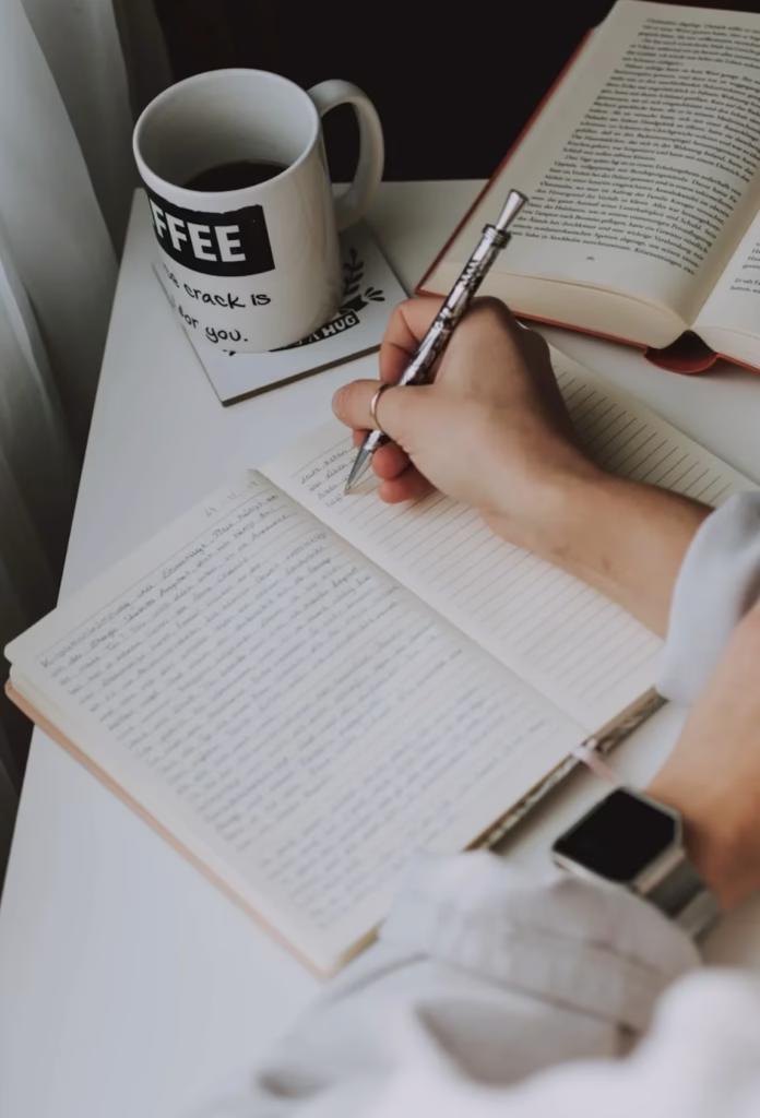 Woman writting notes on a notepad